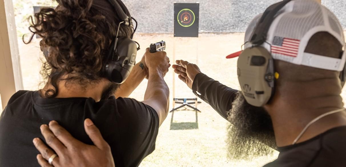 two men shooting and instructing