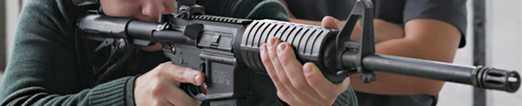 person shooting an AR carbine