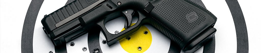 Gun and target with shot bullseye