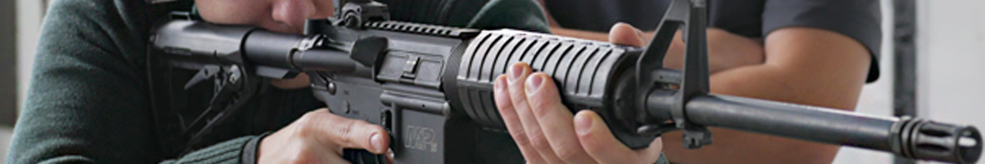 person shooting an AR carbine