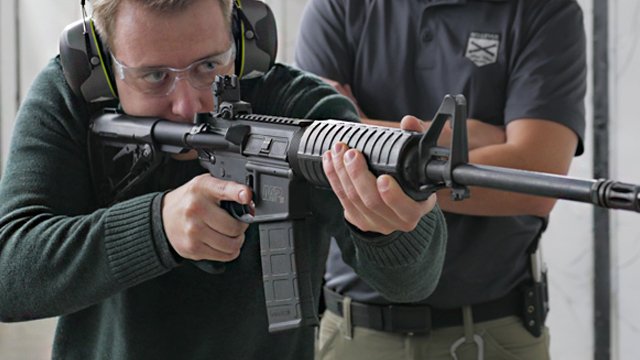 person shooting an AR carbine