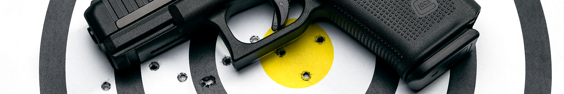 Gun and target with shot bullseye