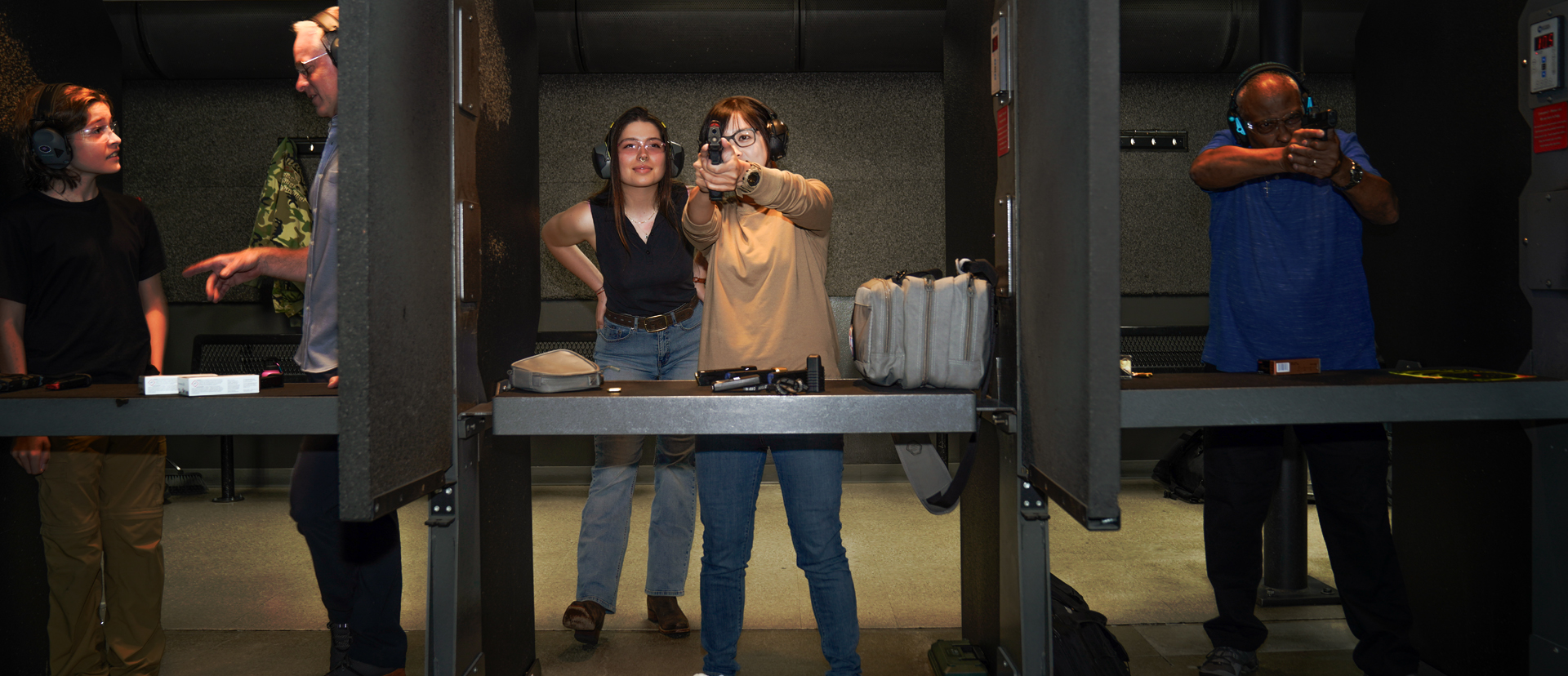 People shooting at Bellevue Gun Club's indooe range