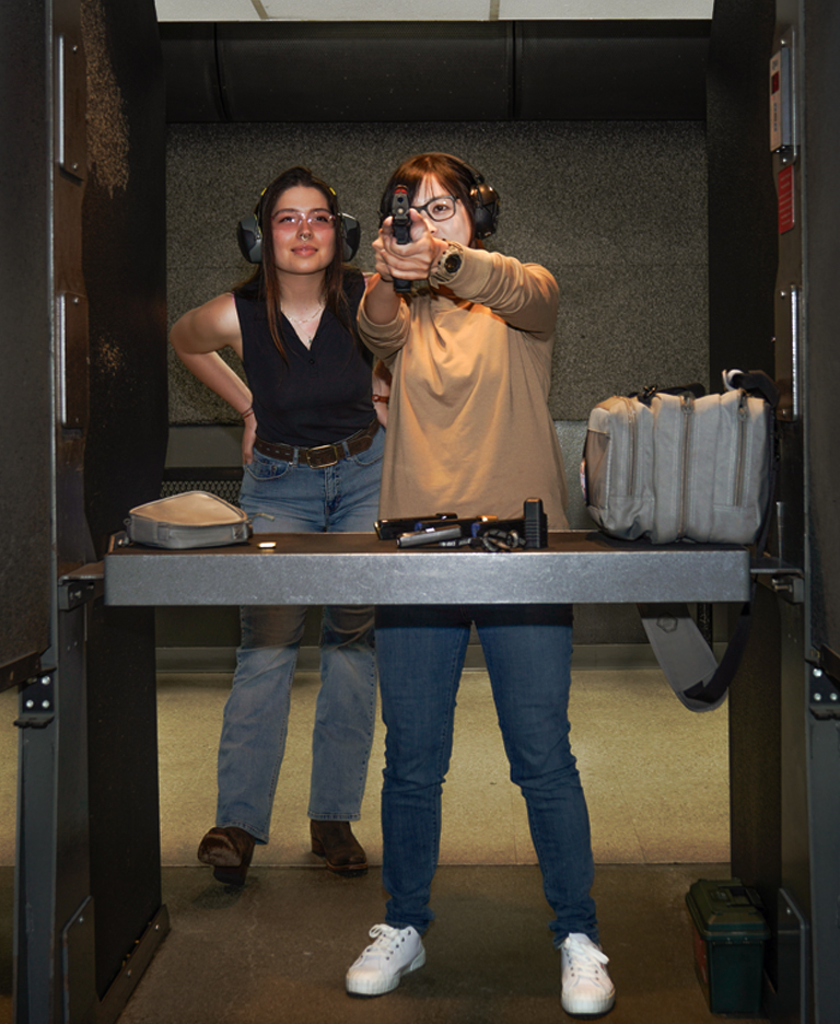 People shooting at Bellevue Gun Club's indooe range