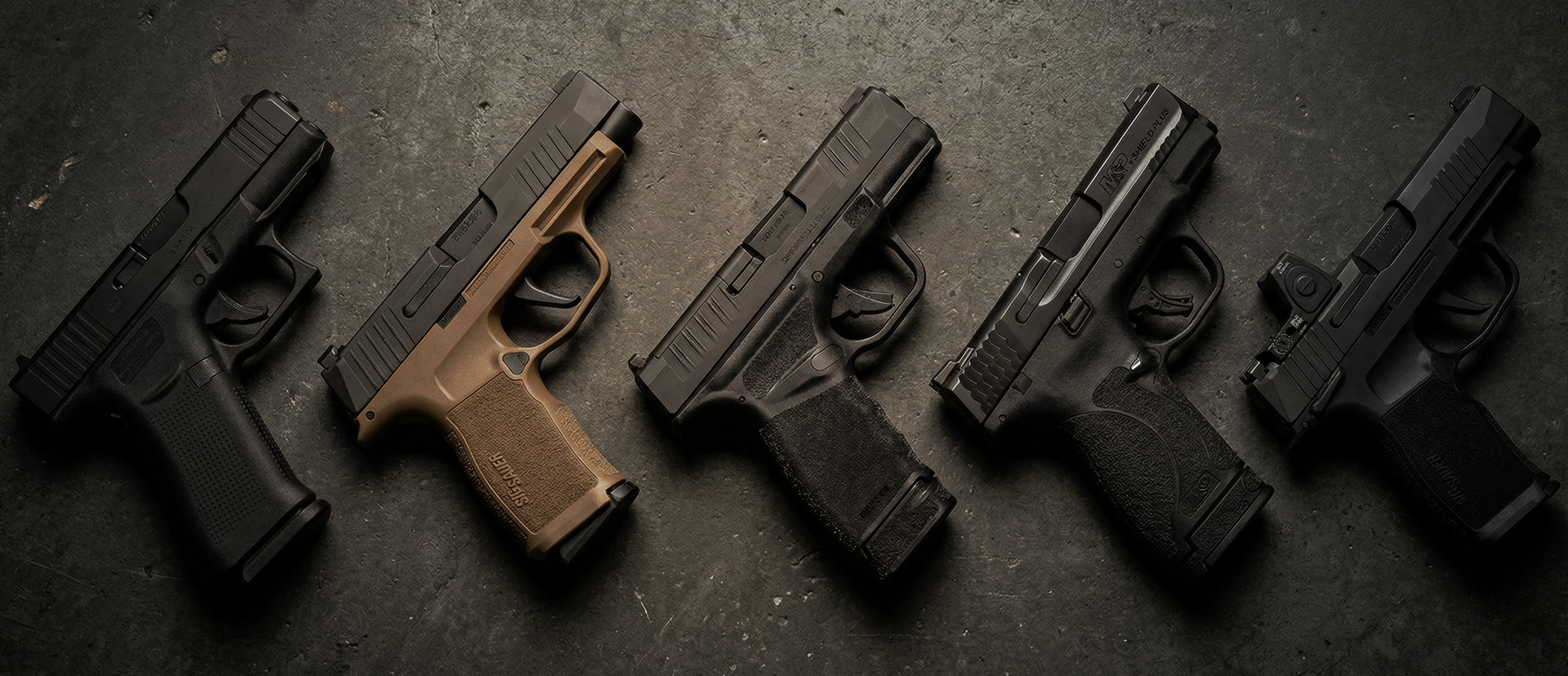 array of 9mm semi-automatic handguns on a table