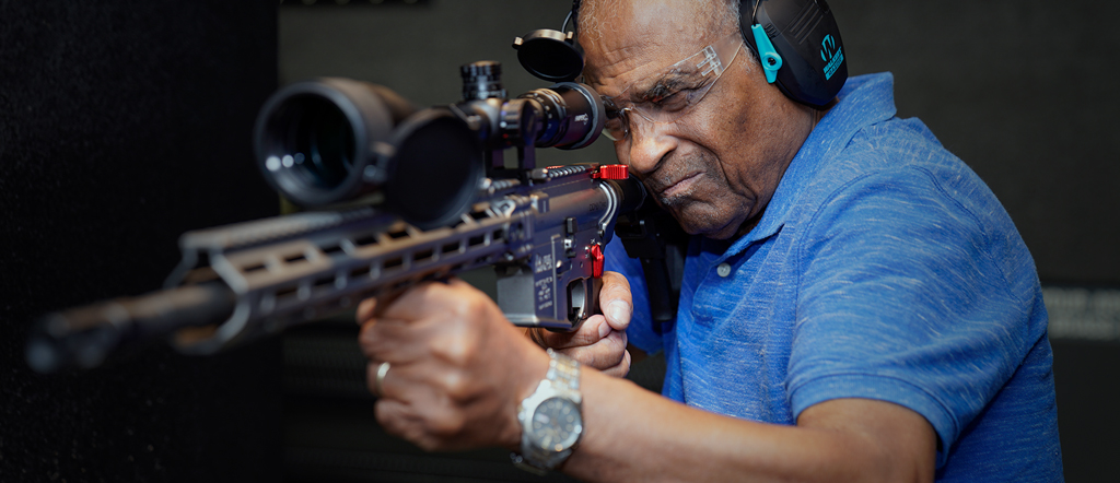 Man shooting rifle